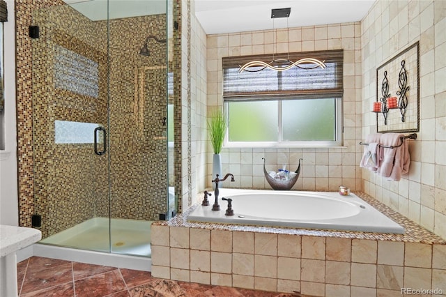 full bath featuring a bath and a stall shower