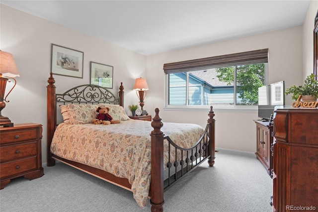 bedroom with carpet flooring and baseboards