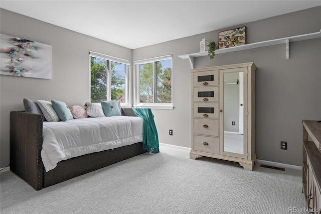 carpeted bedroom with baseboards