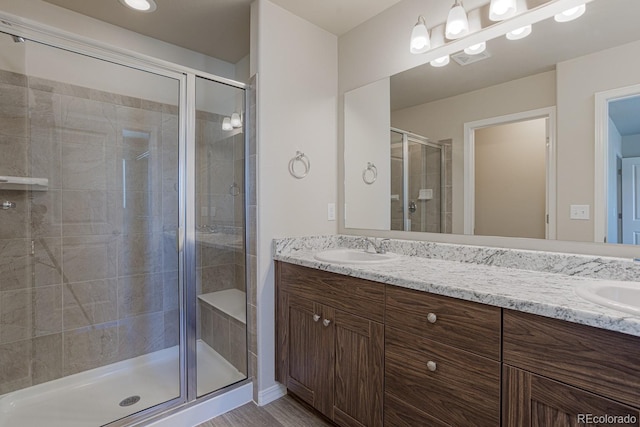 814 N Bently St, Watkins, CO 80137 - full bathroom with double vanity and a stall shower