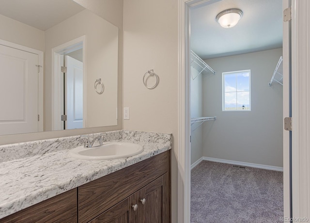 814 N Bently St, Watkins, CO 80137 - bathroom featuring vanity and baseboards