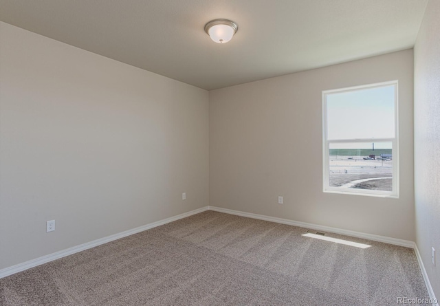 814 N Bently St, Watkins, CO 80137 - carpeted spare room with baseboards