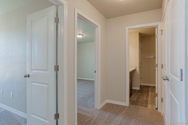 814 N Bently St, Watkins, CO 80137 - hallway featuring carpet floors and baseboards