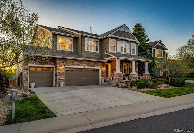 craftsman inspired home featuring driveway, a garage, a porch, and stone siding