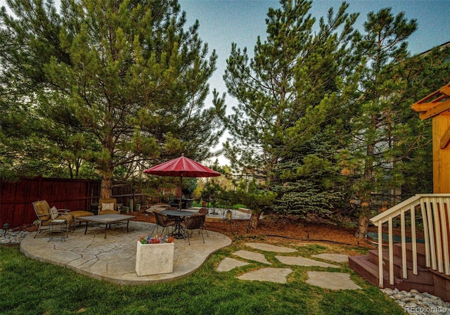 view of yard featuring a patio area and fence