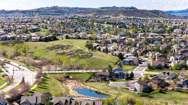 aerial view of residential area with a water and mountain view