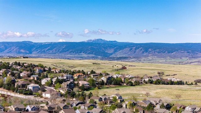 aerial view of residential area featuring a mountain backdrop