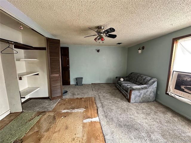 unfurnished room featuring a ceiling fan and a textured ceiling