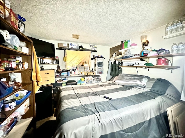 bedroom featuring a textured ceiling