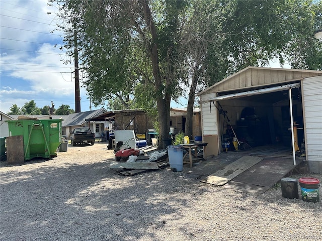 view of side of property with an outbuilding and a detached garage