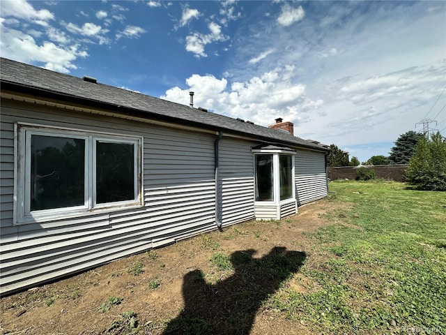 view of side of property featuring a chimney