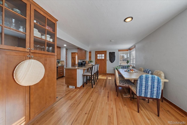 dining room featuring light hardwood / wood-style flooring