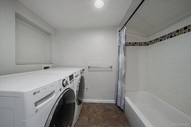 laundry room featuring washing machine and clothes dryer