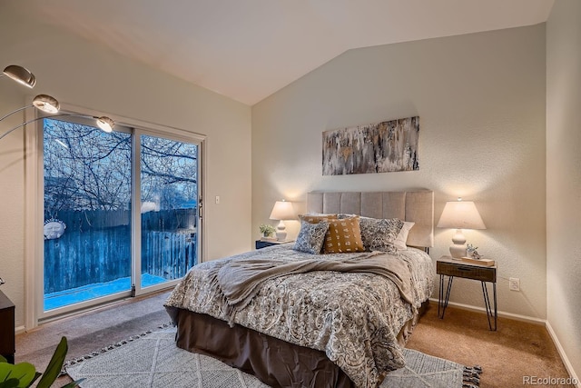 bedroom with access to exterior, carpet, a textured wall, vaulted ceiling, and baseboards