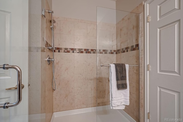 bathroom with a tile shower