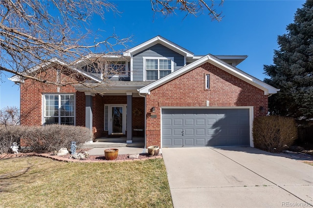 traditional home featuring a front yard, concrete driveway, brick siding, and an attached garage