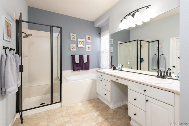 full bathroom featuring a stall shower, a garden tub, a sink, and double vanity
