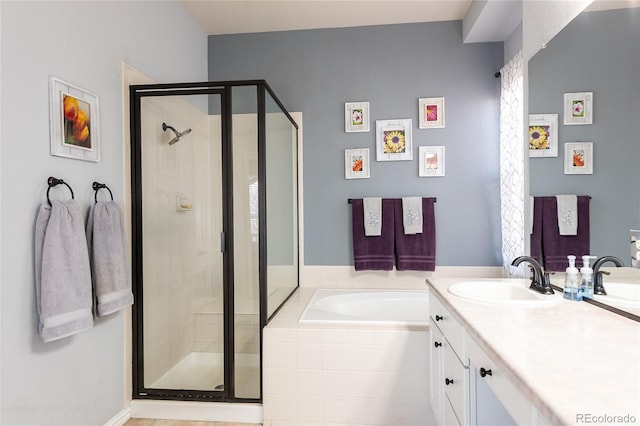 full bathroom with a garden tub, a shower stall, and vanity