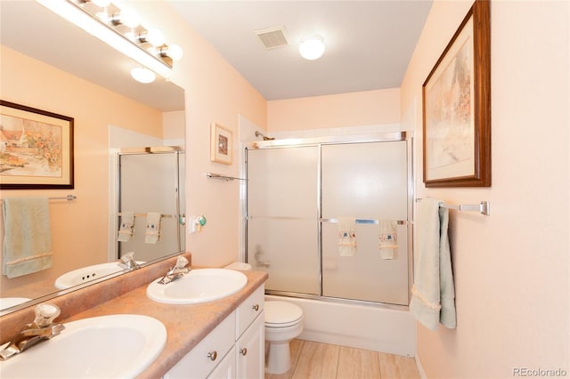 full bath featuring visible vents, a sink, and toilet