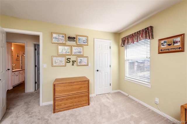 hall with carpet floors and baseboards