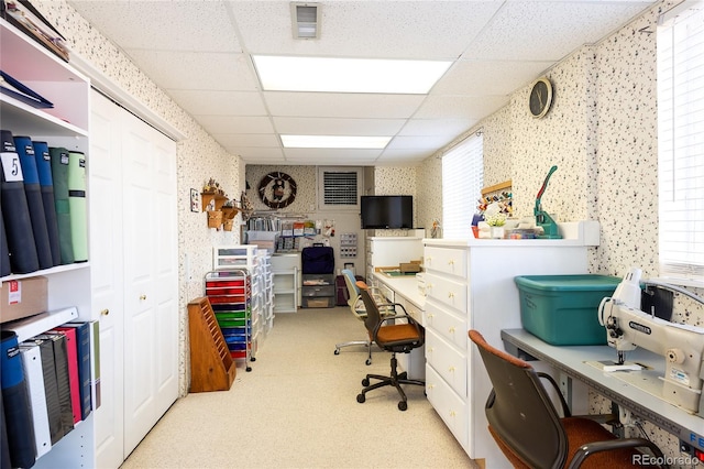 home office with visible vents, carpet, a paneled ceiling, and wallpapered walls