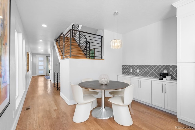 dining space featuring light wood-type flooring