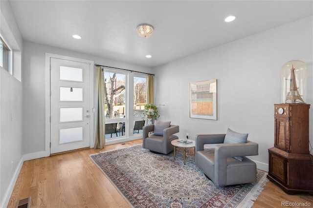 sitting room with light wood-type flooring