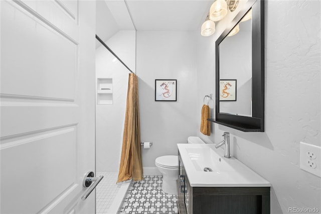 bathroom with vanity, toilet, and a shower with shower curtain