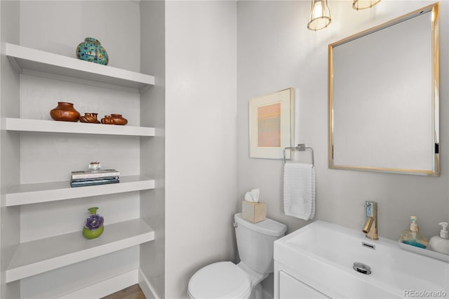 bathroom with vanity and toilet