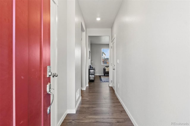 hallway featuring dark wood-type flooring