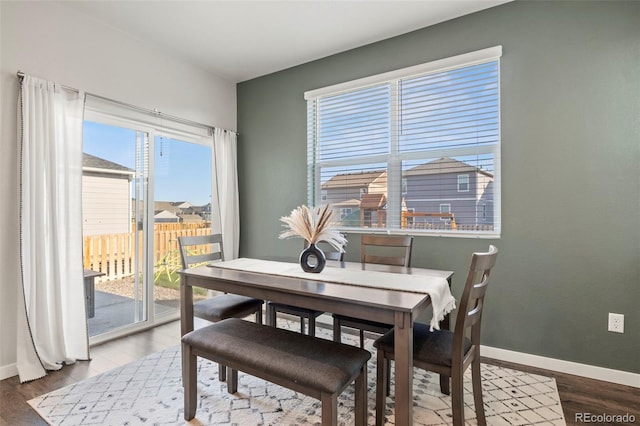 dining room with hardwood / wood-style flooring