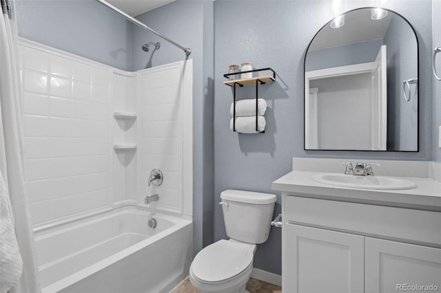 full bathroom featuring shower / bath combo, vanity, and toilet