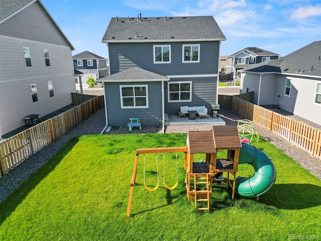 back of house with a playground, an outdoor living space, a lawn, and a patio