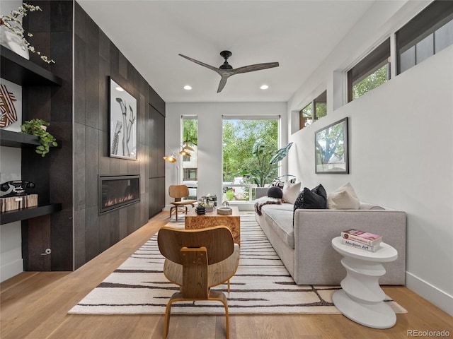 3715 Kalamath St, Denver, CO 80211 - living room featuring a fireplace, light wood-style flooring, recessed lighting, ceiling fan, and baseboards