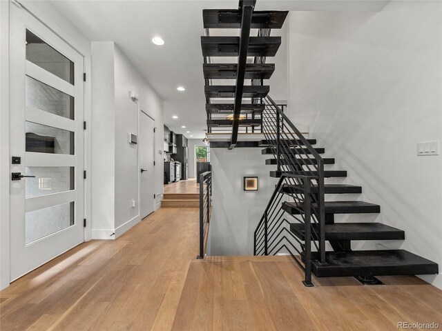 3715 Kalamath St, Denver, CO 80211 - staircase featuring recessed lighting, wood finished floors, and baseboards