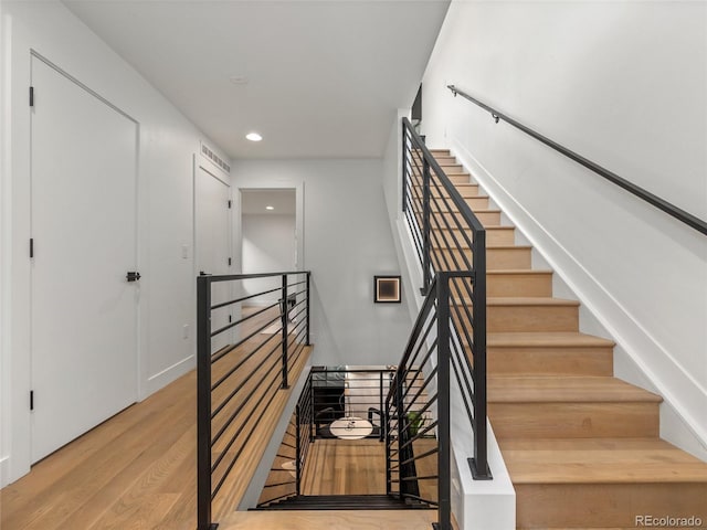 3715 Kalamath St, Denver, CO 80211 - staircase featuring wood finished floors and recessed lighting