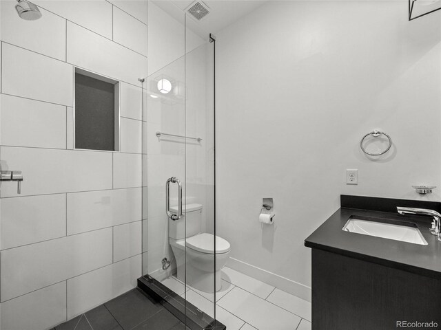 3715 Kalamath St, Denver, CO 80211 - full bathroom featuring toilet, a shower stall, vanity, and tile patterned flooring
