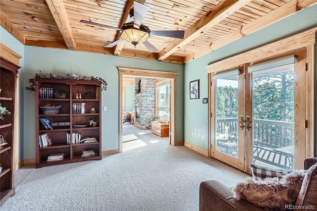 9659 S Turkey Creek Rd, Morrison, CO 80465 - sitting room with wood ceiling with exposed beams, healthy amount of natural light, baseboards, and carpet flooring