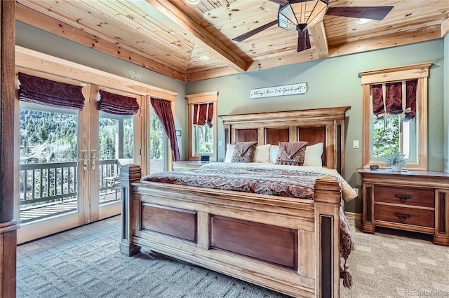 9659 S Turkey Creek Rd, Morrison, CO 80465 - bedroom featuring light colored carpet, wooden ceiling with exposed beams, access to outside, multiple windows, and recessed lighting