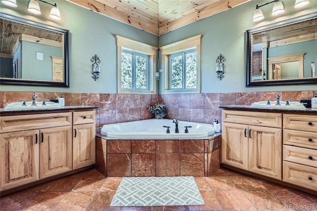 9659 S Turkey Creek Rd, Morrison, CO 80465 - full bathroom with two vanities and a bath