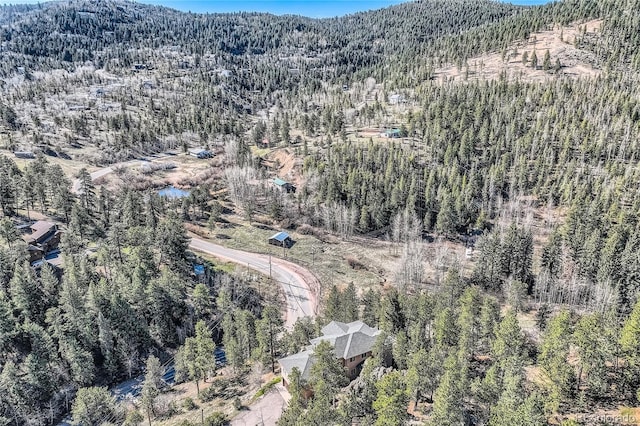 9659 S Turkey Creek Rd, Morrison, CO 80465 - aerial overview of property's location with a forest and a mountainous background
