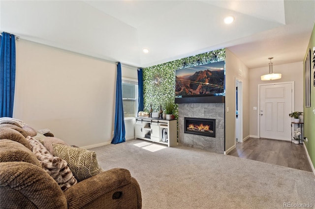 254 Gila Trl, Ault, CO 80610 - living area with carpet flooring, a tiled fireplace, baseboards, and recessed lighting