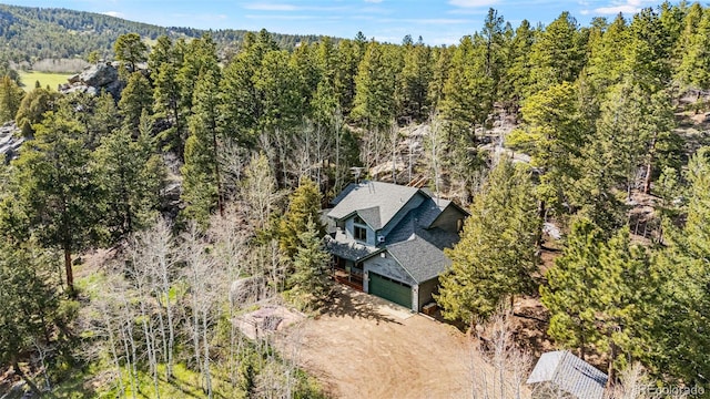 597 Pine Glade Rd, Nederland, CO 80466 - aerial view of property and surrounding area featuring a heavily wooded area