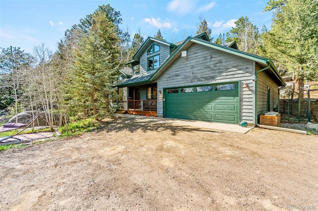 597 Pine Glade Rd, Nederland, CO 80466 - view of front of house with driveway and an attached garage