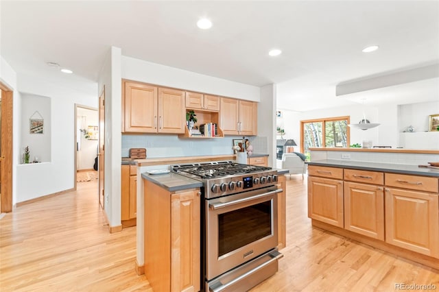 597 Pine Glade Rd, Nederland, CO 80466 - kitchen featuring gas range, light wood-type flooring, light brown cabinetry, recessed lighting, and dark countertops