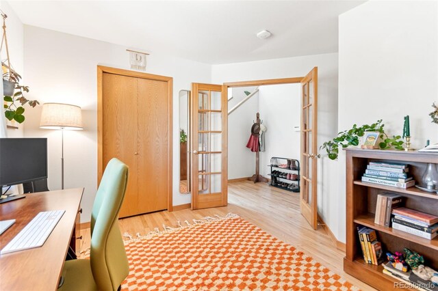 597 Pine Glade Rd, Nederland, CO 80466 - home office with french doors and wood finished floors