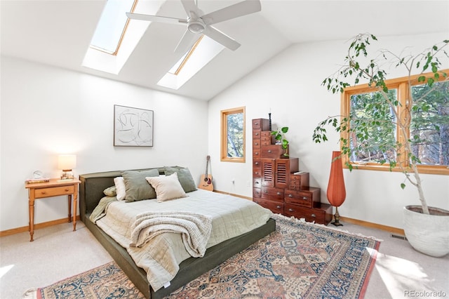 597 Pine Glade Rd, Nederland, CO 80466 - carpeted bedroom featuring lofted ceiling, baseboards, a skylight, and ceiling fan