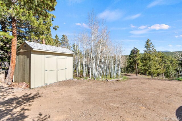 597 Pine Glade Rd, Nederland, CO 80466 - view of yard with a shed and an outbuilding