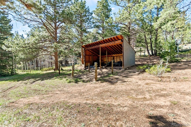 597 Pine Glade Rd, Nederland, CO 80466 - view of yard featuring an outbuilding and an outdoor structure