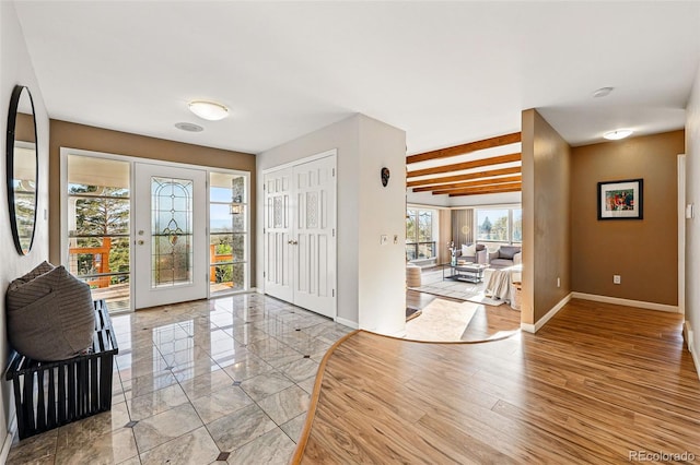 8090 Newton St, Westminster, CO 80031 - foyer with baseboards and light wood-style flooring